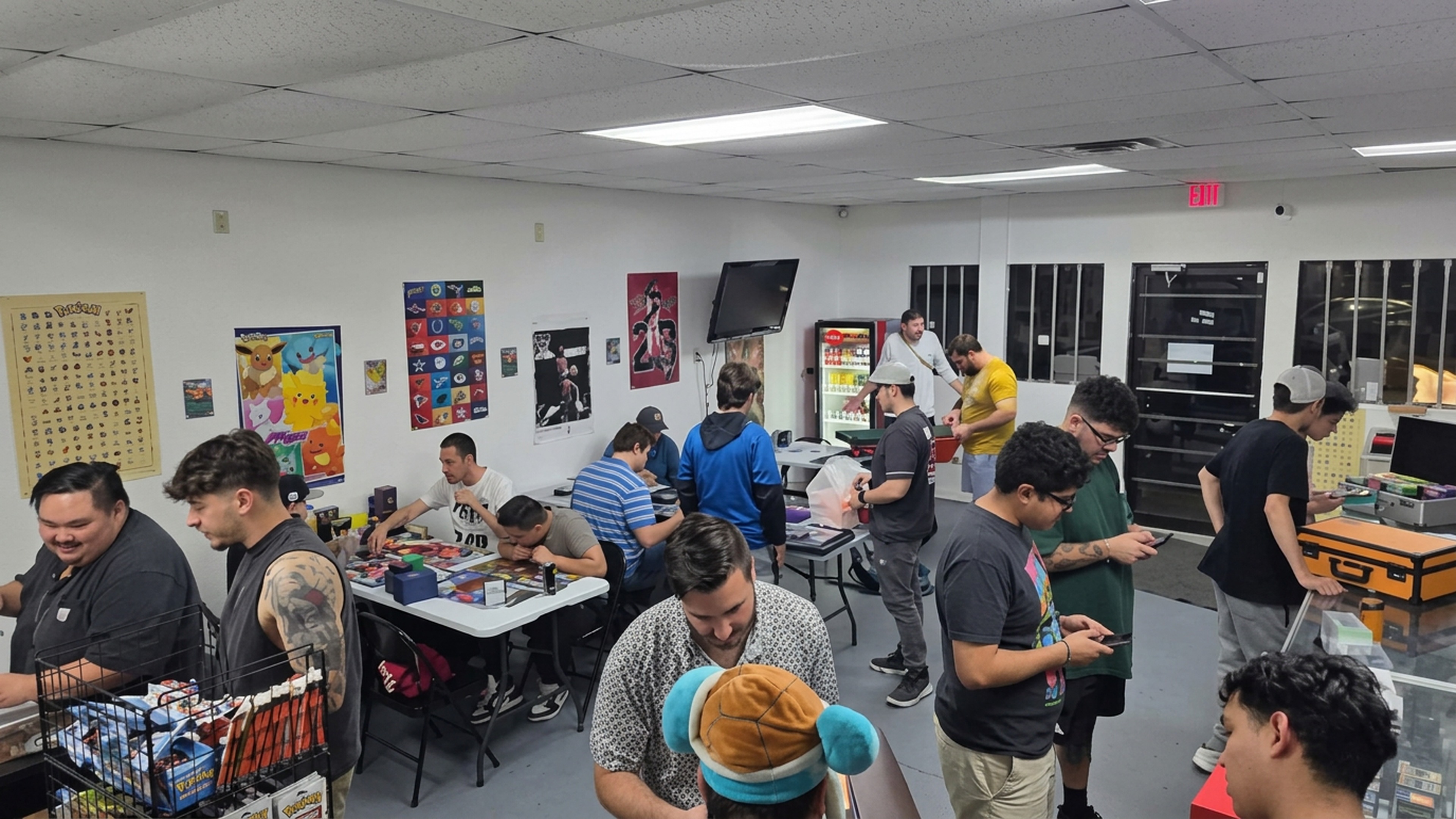 The CardHouse community trading cards and playing together inside the store