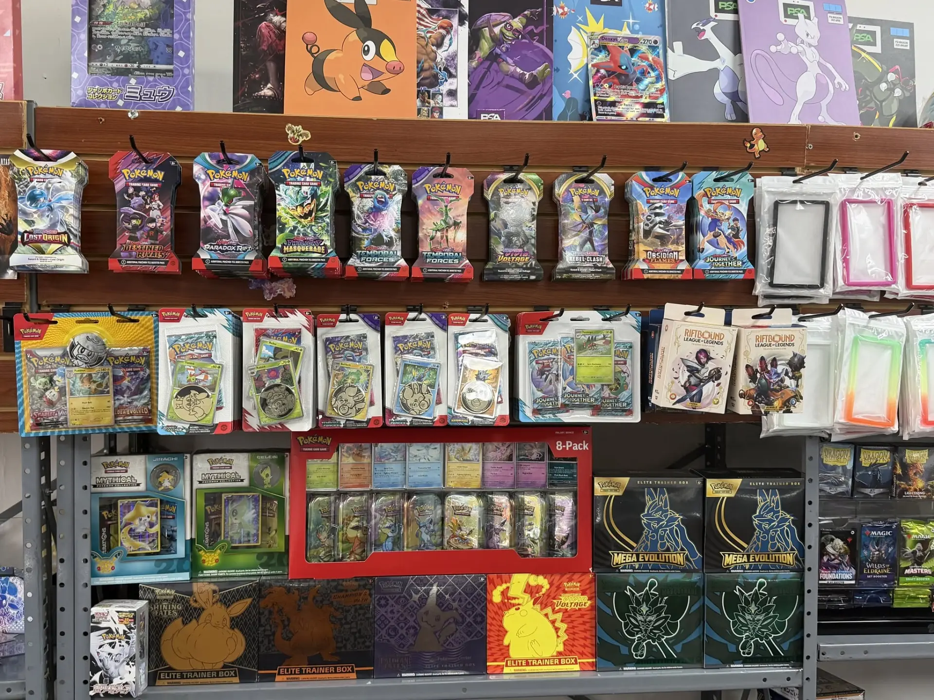 Pokémon booster packs and Elite Trainer Boxes on CardHouse shelves
